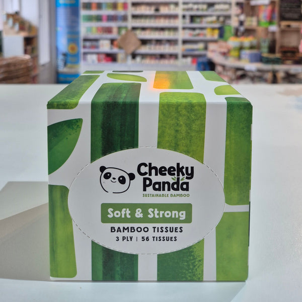 Box of Cheeky Panda bamboo tissues with green and white design on a store shelf background