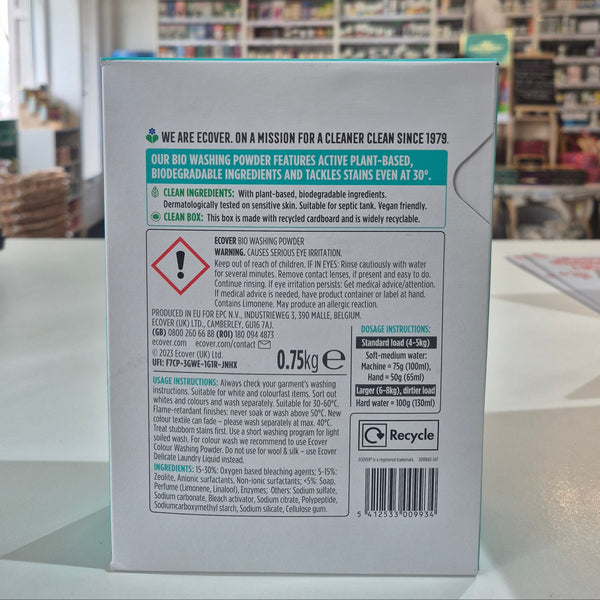 Product packaging with text and labels on a blurred indoor background