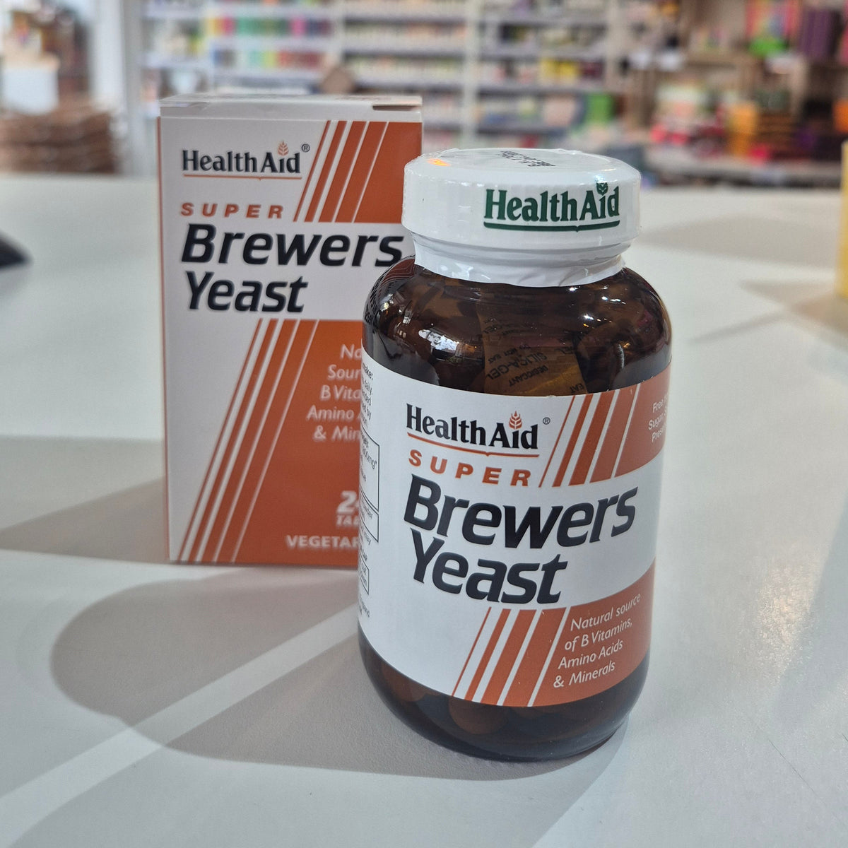 Health Aid Super Brewers Yeast supplement bottle and packaging on a surface.