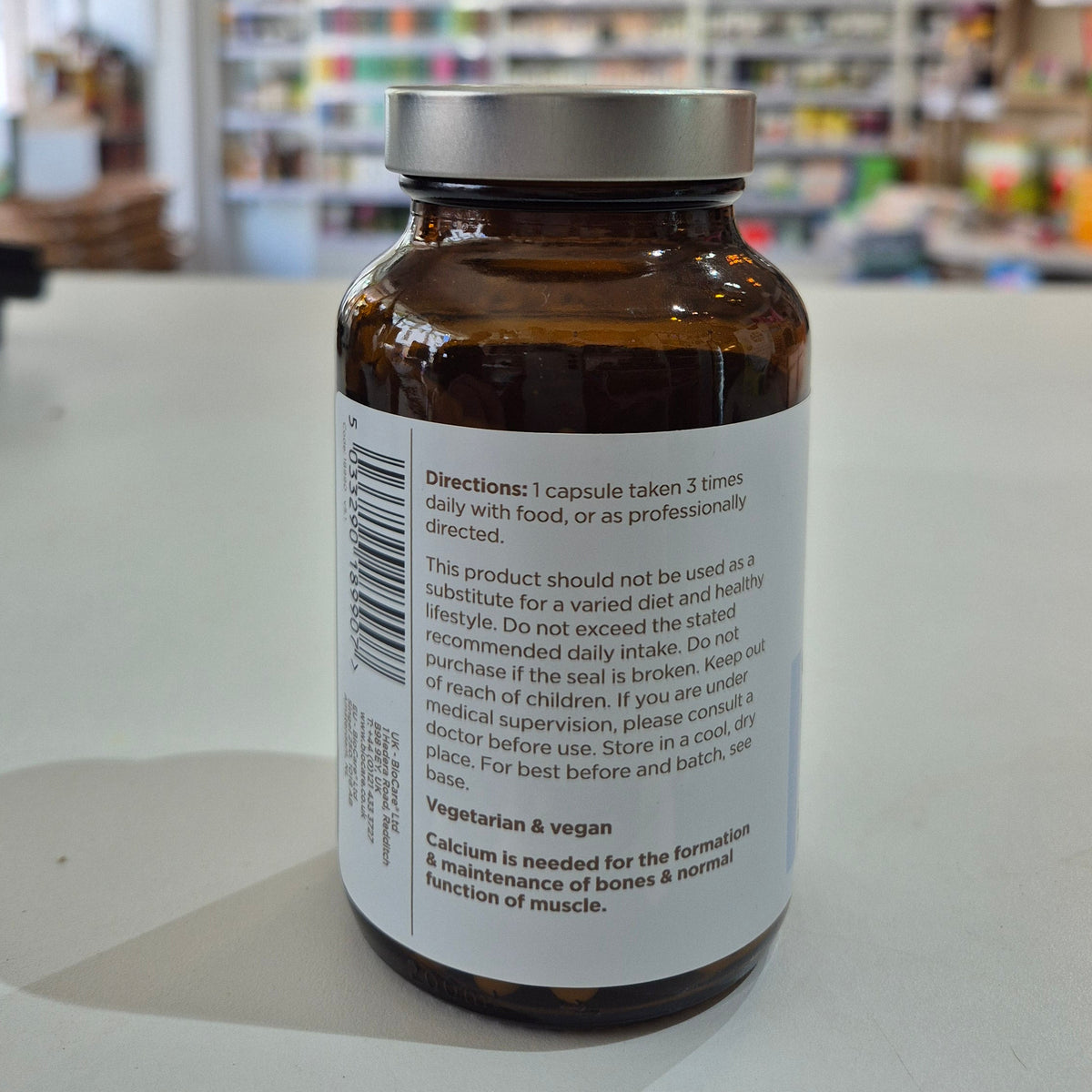 A bottle of Biocare Calcium Citrate containing 90 capsules for bone and muscle support side of the jar