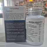 NaturesPlus supplement bottle and packaging on a white surface with a blurred background
