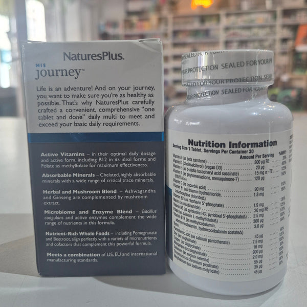 NaturesPlus supplement bottle and packaging on a white surface with a blurred background