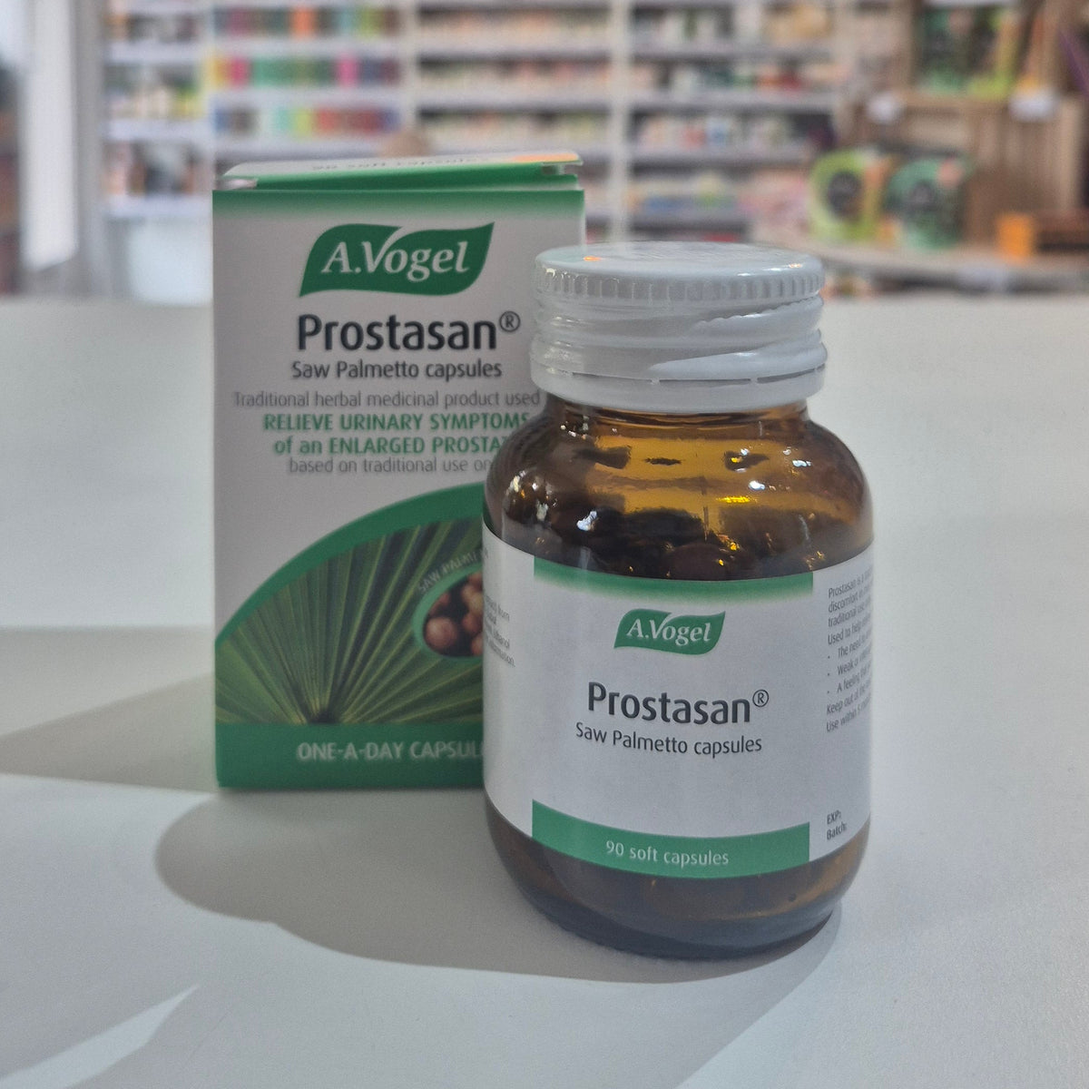 A bottle and packaging of A.Vogel Prostasan 90 capsules on a table.