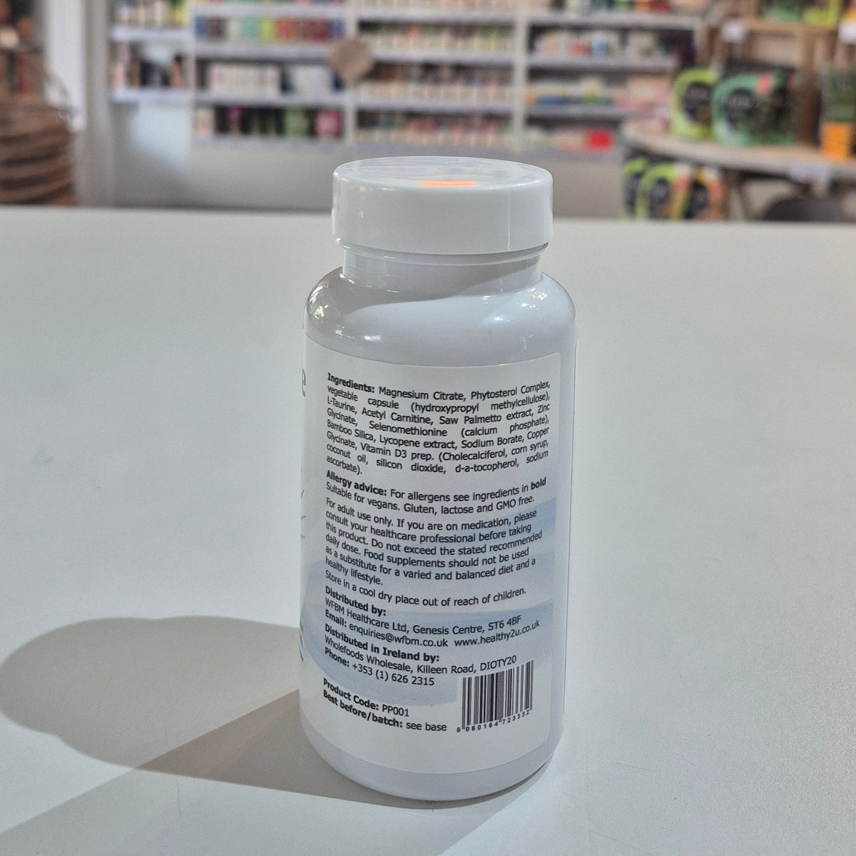 Bottle with a label on a light surface, blurred background