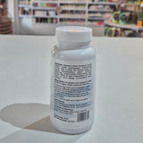 Bottle with a label on a light surface, blurred background