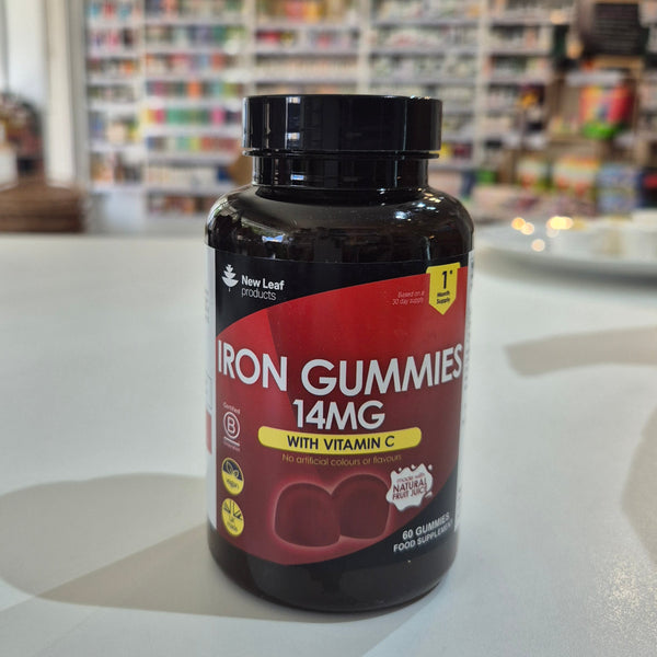 Bottle of Iron Gummies with Vitamin C on a counter in a store setting
