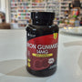Bottle of Iron Gummies with Vitamin C on a counter in a store setting