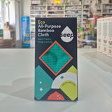 Box of eco-friendly all-purpose bamboo cloth with a blurred store interior in the background