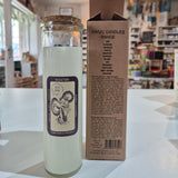Bottle with a label and box on a white surface