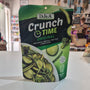 A bag of DJ&A Crunch Time Original green radish, broccoli, and snap pea crisp bites standing on a white countertop in a store.