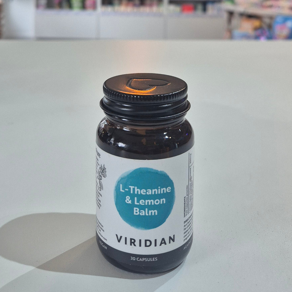 Bottle of Viridian L-Theanine & Lemon Balm on a light surface