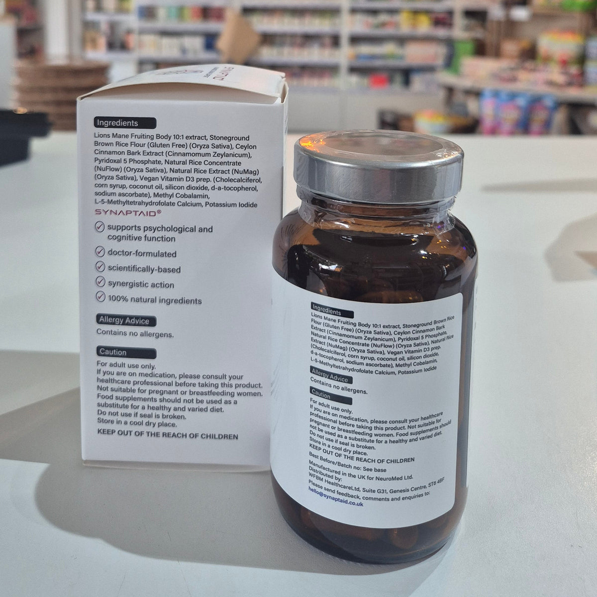 A bottle of Synaptaid Advanced Brain Support supplement with its packaging box, displaying the product name and brief description.
