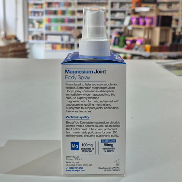 Magnesium Joint Body Spray packaging with a blurred store background