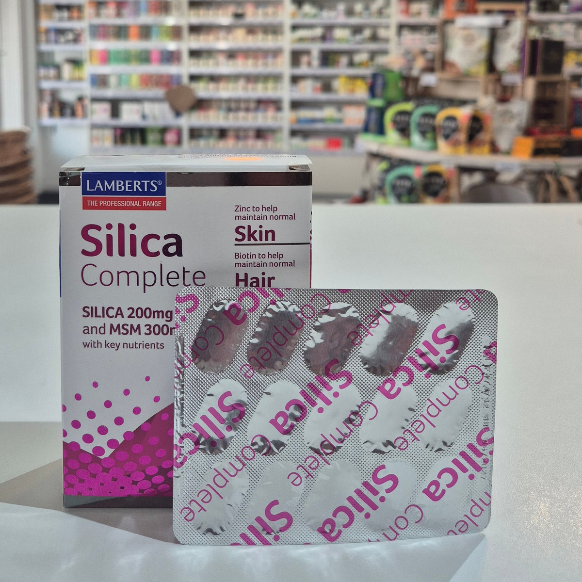 Silica supplement boxes in a store setting with shelves and products in the background