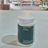 Supplement container on a counter with a blurred store background