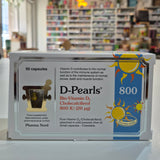 Box of D-Pearls Vitamin 800 D3 supplement with a blurred store background