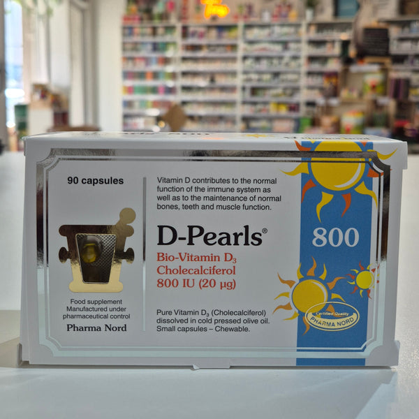Box of D-Pearls Vitamin 800 D3 supplement with a blurred store background
