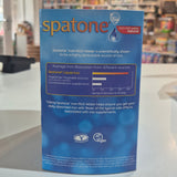 Spatone vitamin supplement packaging held in front of a blurred store interior.