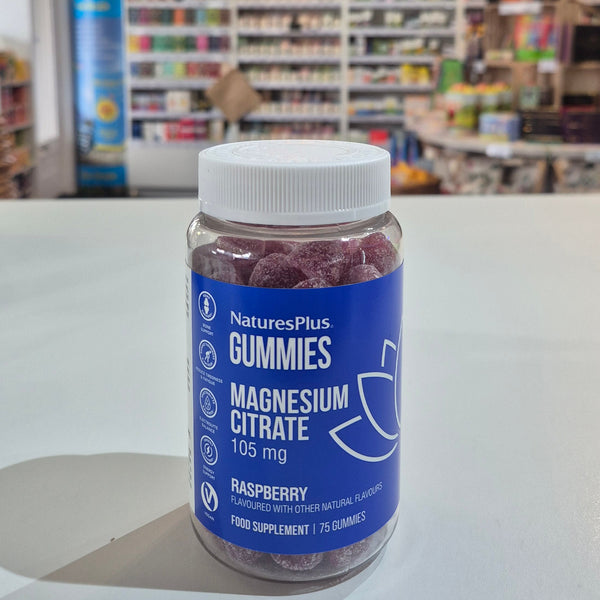 Bottle of magnesium citrate on a counter with a store interior in the background