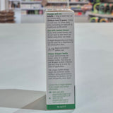 Eye drop container with label on a blurred background