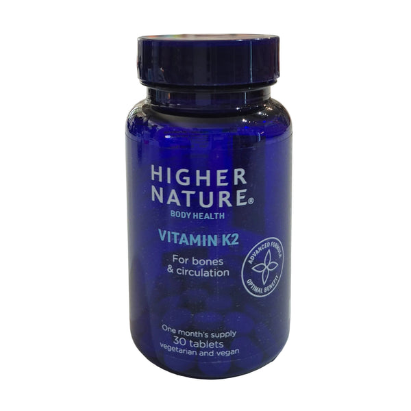 Blue bottle of Higher Nature Vitamin K2 on a light background