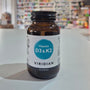 Brown bottle of Viridian Vitamin D3 & K2 on a white surface with a blurred store background