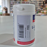 Close-up of a cylindrical container with a label, blurred background