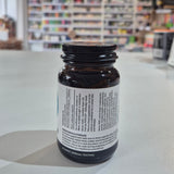 Bottle of Viridian Bromelain 500mg on a counter in a store setting. Brown supplement bottle with label on a light surface, blurred store shelves in the background