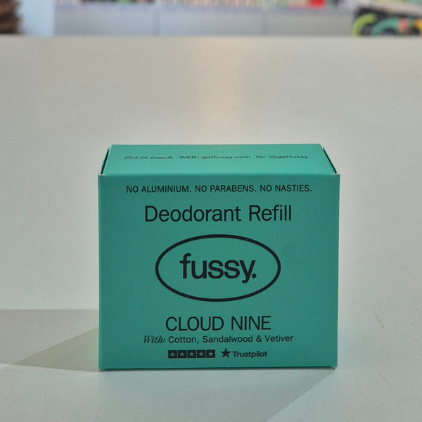Green box of fussy Cloud Nine deodorant refill on a light surface