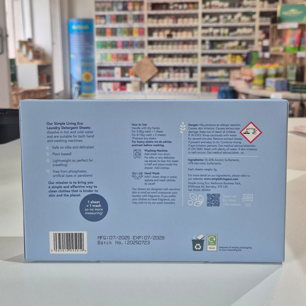 Product packaging with text and symbols on a shelf in a store