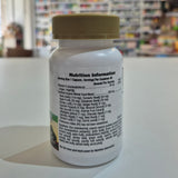 Nutritional information label on a supplement bottle with a blurred store background