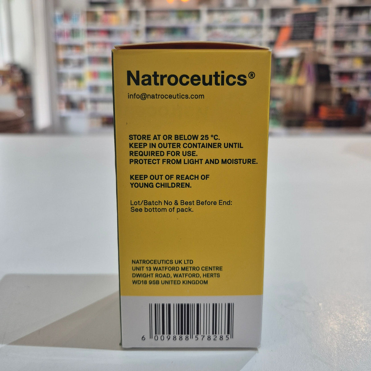 Natroceutics product packaging with text on a blurred background