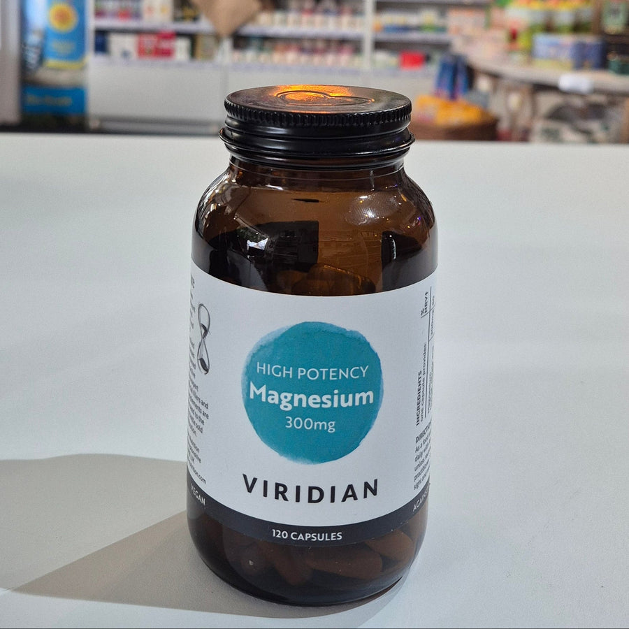 Bottle of Viridian supplements on a white surface with a blurred background