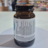 Brown supplement bottle with label on a white surface