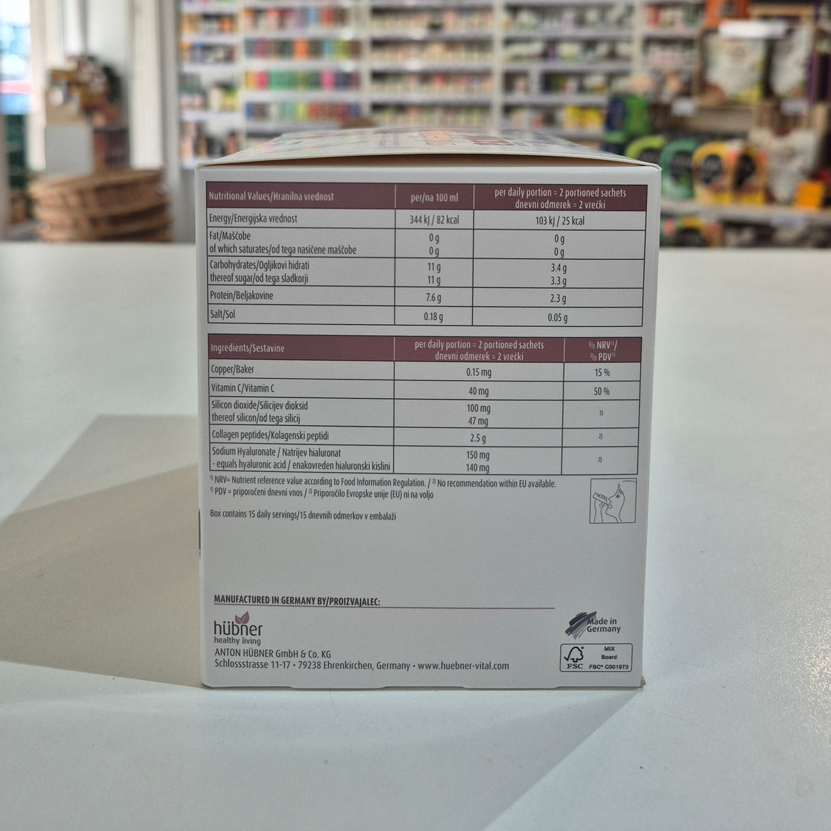 Box with nutritional information on a white surface, blurred store background