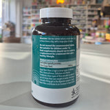 Supplement bottle with label in a pharmacy setting