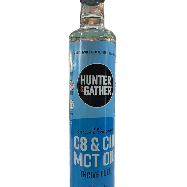 Bottle of Hunter & Gather MCT oil with a blue label on a white background. 