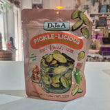 A stand-up pouch of DJ&A Pickle-Licious Kimchi pickles sitting on a white shop interior.