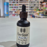 Bottle of Oatsoak Scalp Oil on a white surface with a blurred store background