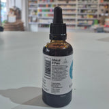 Bottle of Viridian Liquid B12 on a table with a blurred store background. Bottle labeled 'Ethical & Pure' on a surface with a blurred background