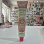 A tube of Tartex Vegetarian Pate Mushrooms on a white countertop with a blurred grocery store background.