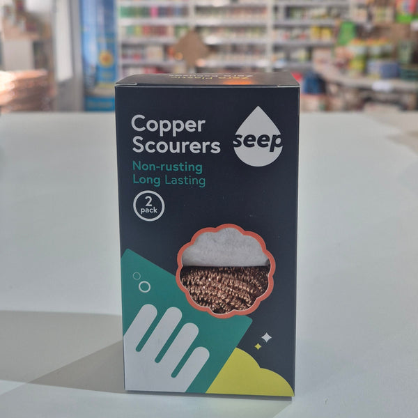 Copper Scourers packaging with a blurred store interior in the background