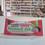 A packaged meringue bar in a red and white wrapper labeled 'Flower & White' and 'Chocolate Dipped Strawberry', placed on a white surface with a blurred store shelf background.