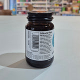 Brown supplement bottle with label on a white surface