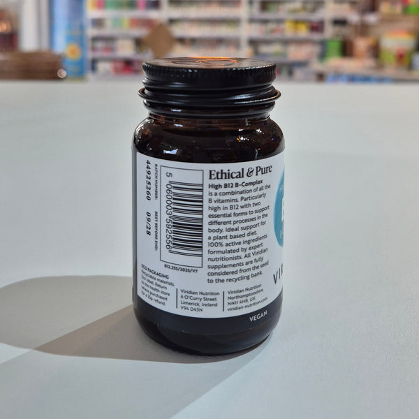 Brown supplement bottle with label on a white surface