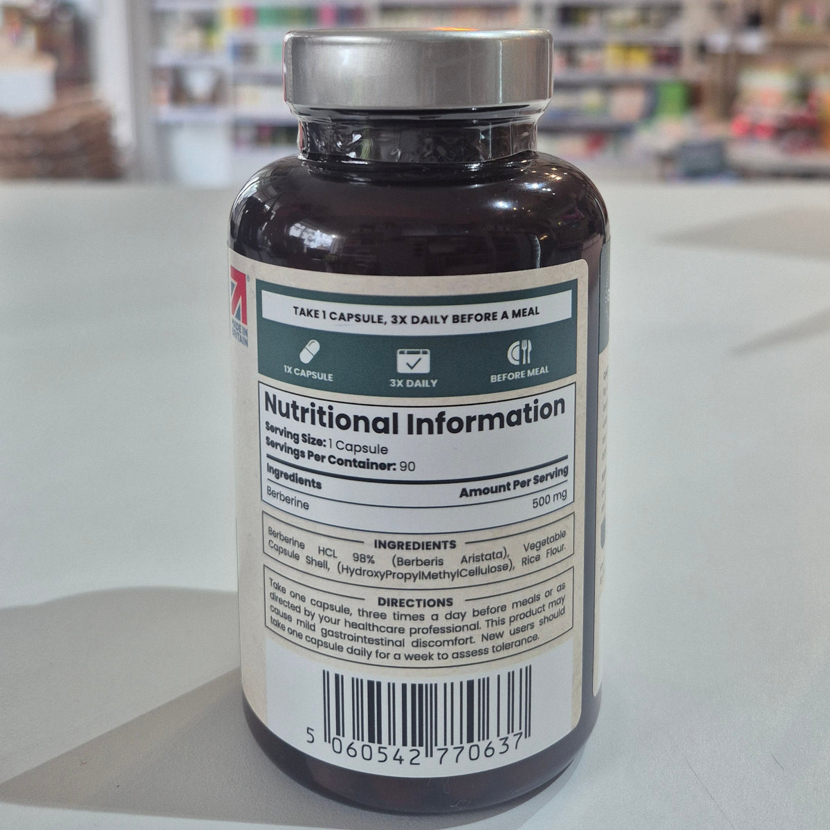 Supplement bottle with label showing nutritional information on a store shelf background