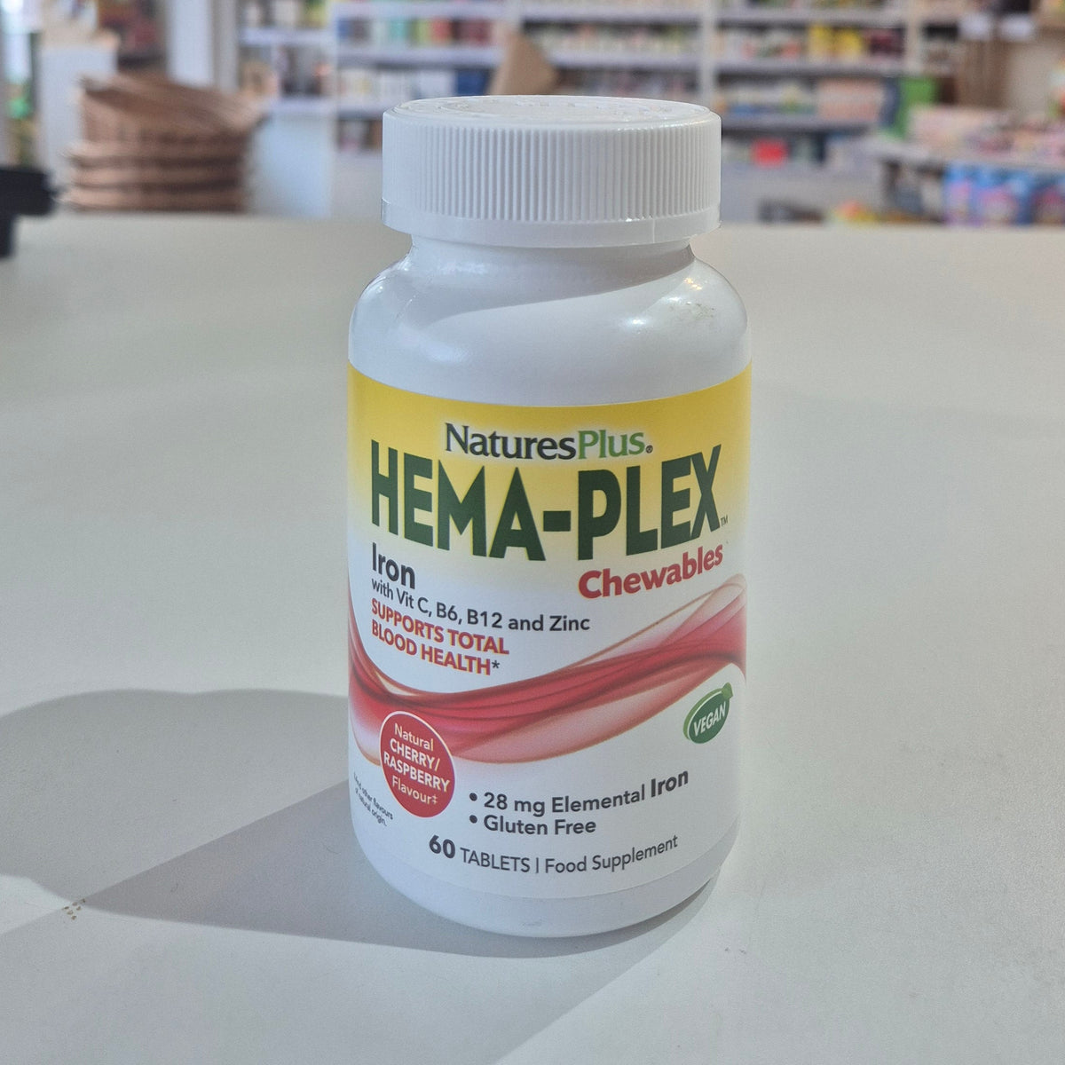 NaturesPlus Hema-Plex Chewables bottle on a counter in a store setting