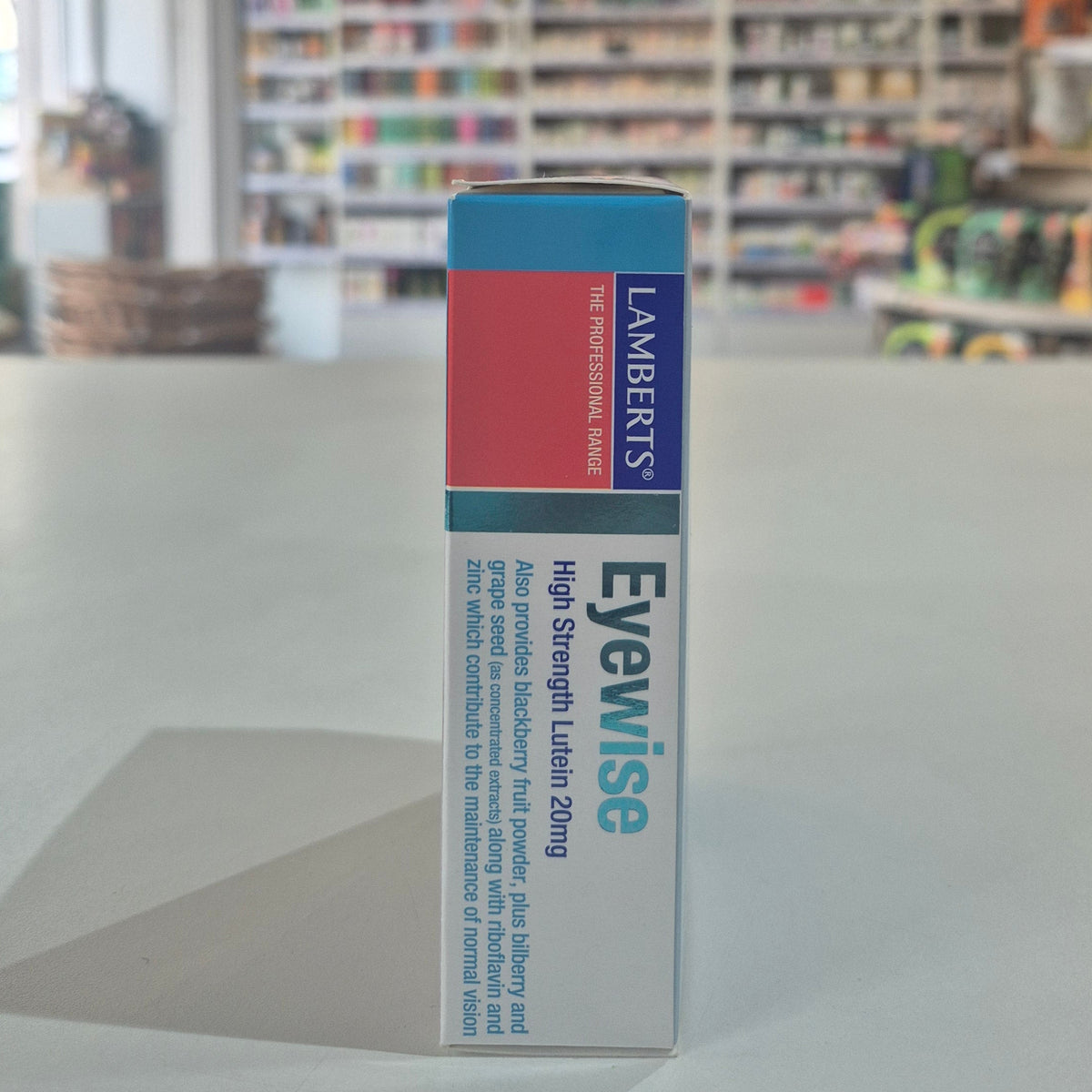 Lambert's Eyewise supplement box on a surface with a blurred background