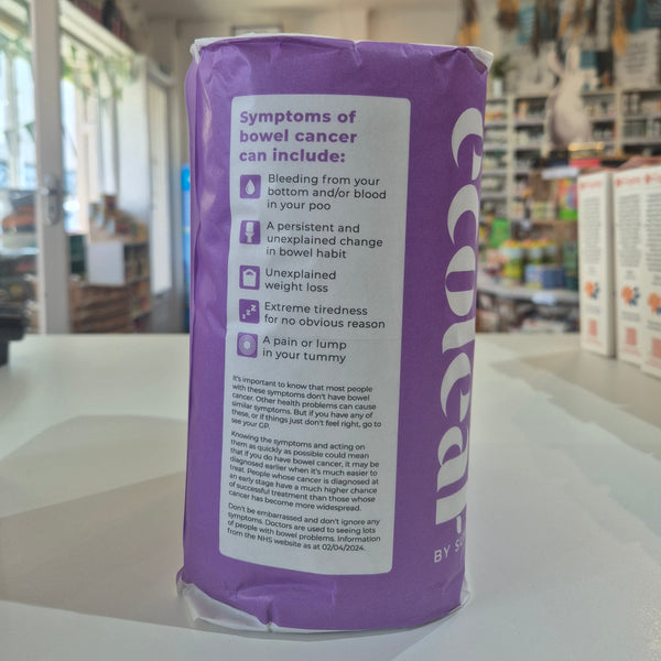 Purple package with text on a white surface,  in a store setting
