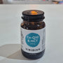 Viridian Co-Q10 & MCT supplement bottle on a white surface with a blurred store background
